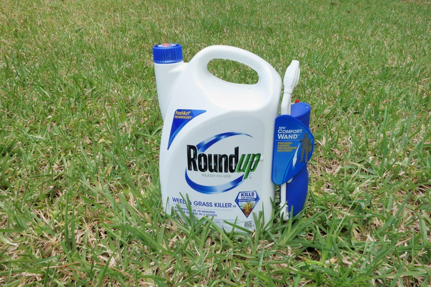 Featured image for RoundUp Lawsuit, showing a container of Roundup Weed and Grass Killer on a grass lawn